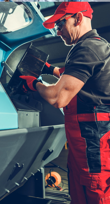 Caucasian Worker in His 40s Operating Metalworking Industry Metal Objects Shaker Cleaning Machinery